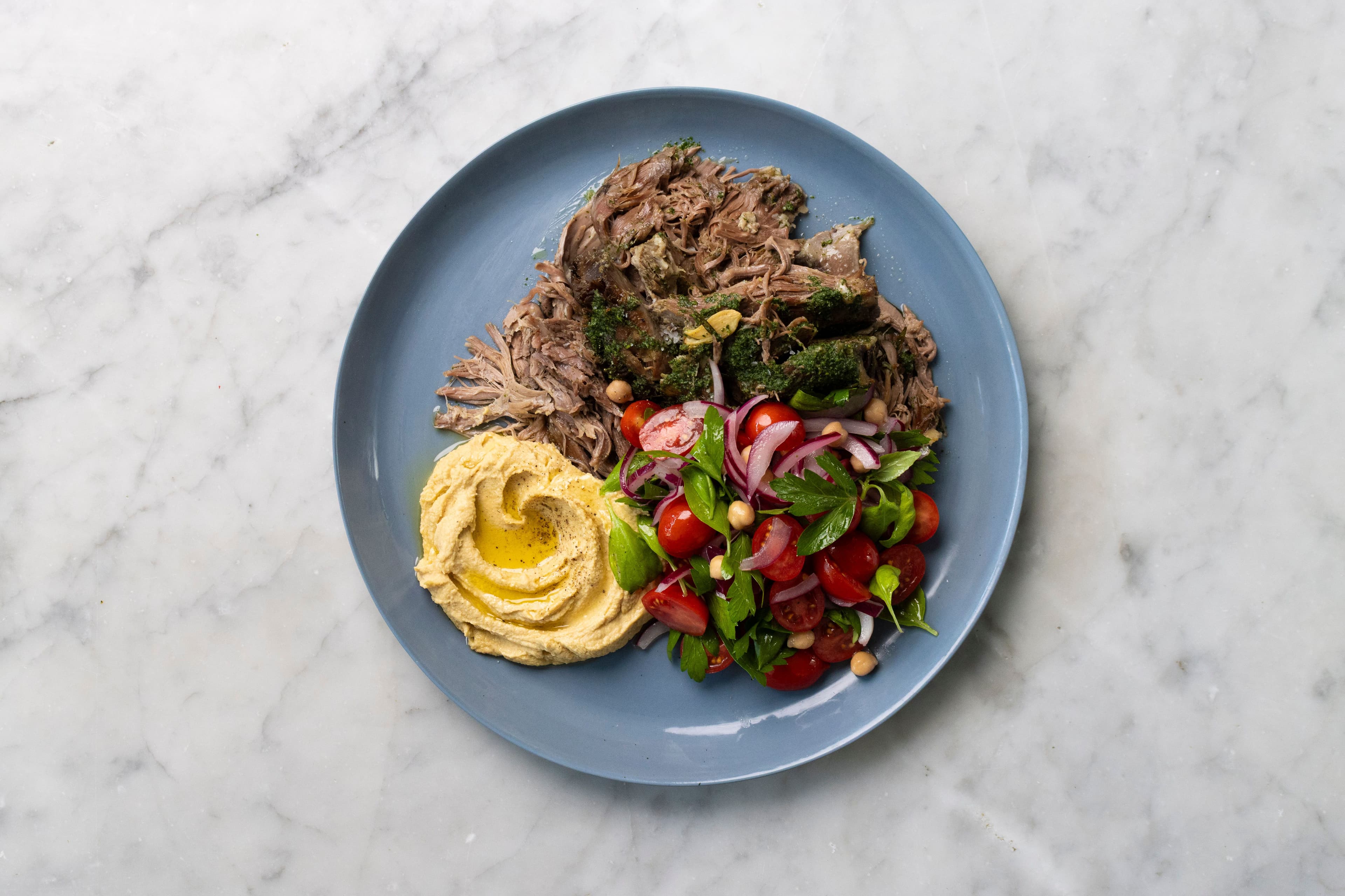 Slow-Cooked Lamb Shoulder with Hummus, Tomato Salad and Mint Salsa recipe preview