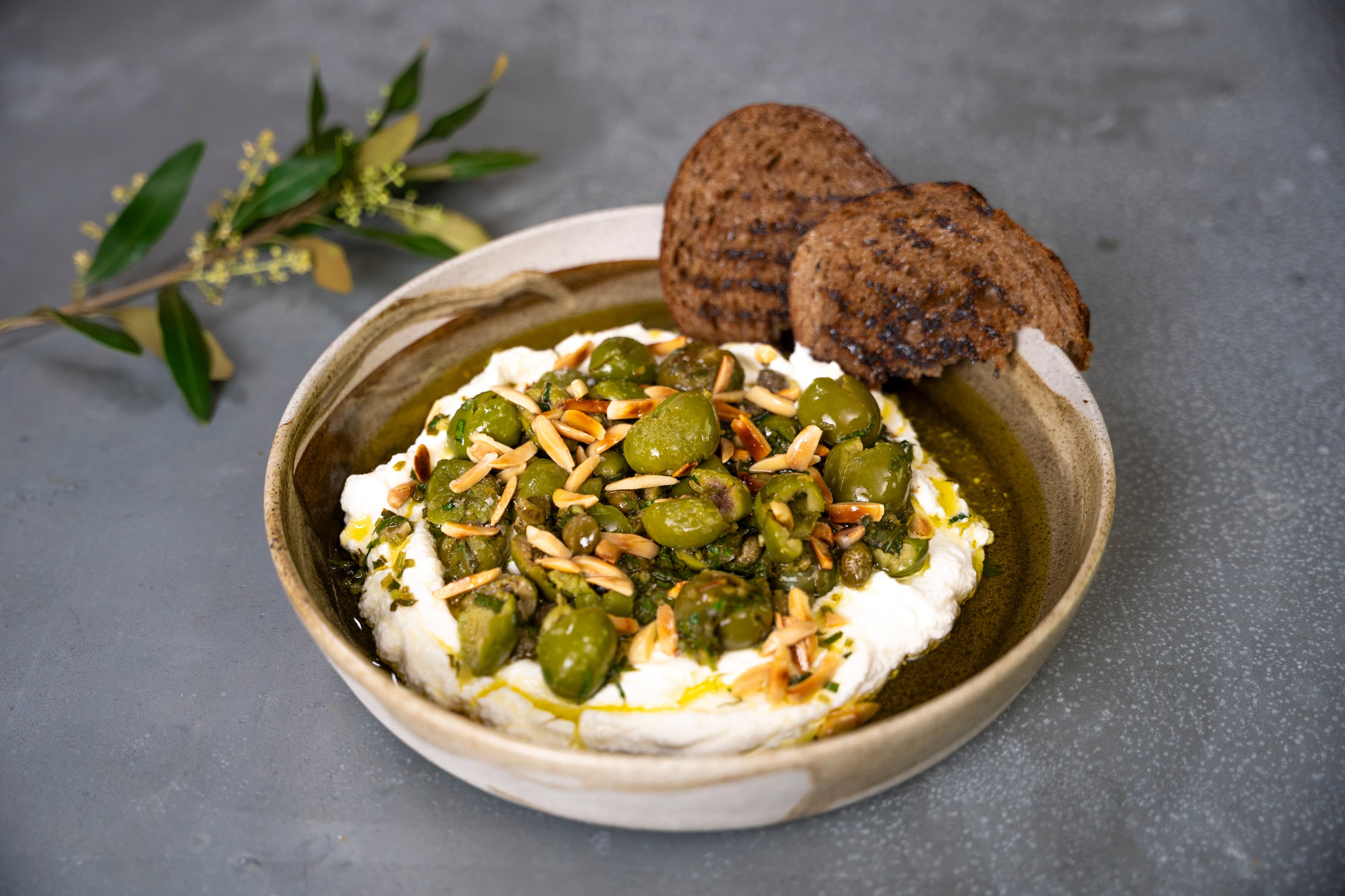 Ricotta with Crushed Olives, Almonds and Lemon recipe preview